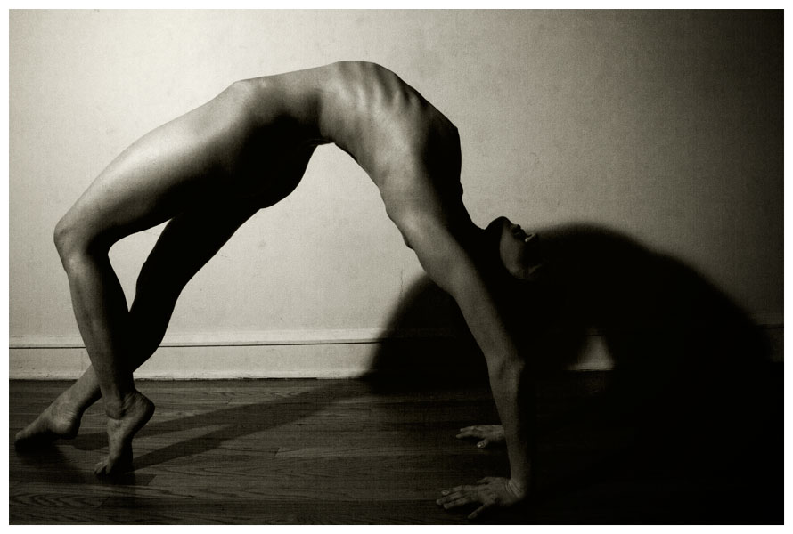 Nude woman bending over backwards